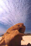 Clouds Radiate from Water Carved Rock (58166 bytes)